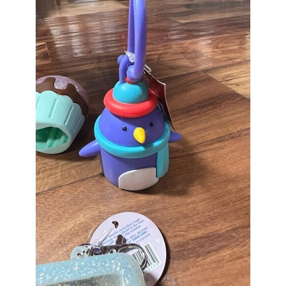 Lot of 6 hand sanitizer cases.   Good vibes, cupcake, penguin, melon - Picture 6 of 7